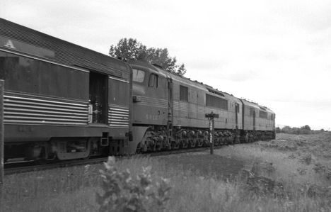 PRR Centipede diesels pull passenger train at Carp Lake, MI